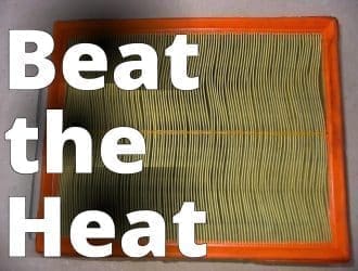 File:Air filter, opel astra(2).JPG - a green and orange air filter on a white surface